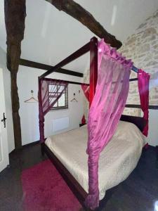 Ένα ή περισσότερα κρεβάτια σε δωμάτιο στο Gîte Malabeille