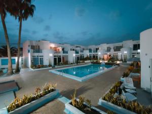 an aerial view of a resort with a swimming pool at BLU in Puerto del Carmen