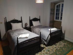 Cama ou camas em um quarto em Quinta Viela Principal