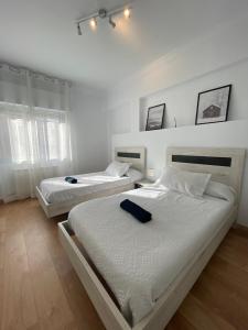 Casa Centro Logroño x6pers tesisinde bir odada yatak veya yataklar