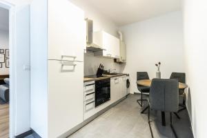 A kitchen or kitchenette at Modern and lovely apartment next to subway station