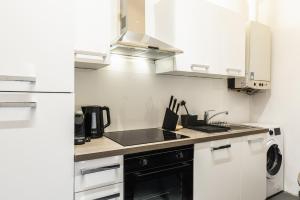 A kitchen or kitchenette at Modern and lovely apartment next to subway station