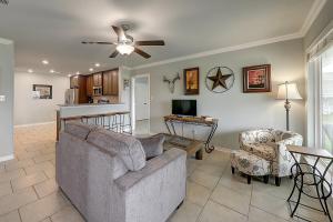 a living room with a couch and a table at Relaxed Beachin in Rockport