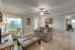 a living room with a couch and a table at Relaxed Beachin in Rockport