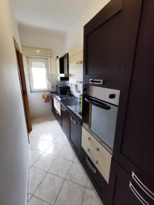 Kuchyň nebo kuchyňský kout v ubytování Scala dei Turchi Apartment