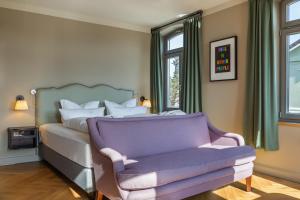 Posteľ alebo postele v izbe v ubytovaní Mimosa Suites
