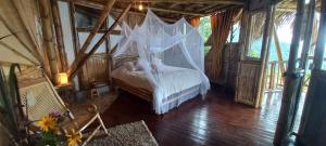 Postel nebo postele na pokoji v ubytování Ecohotel Soplo del Tambo