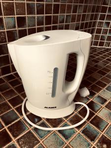 a white toaster sitting on top of a counter at Apartment " LELLGEN " in Wilwerwiltz