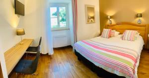 Hôtel Le Troubadour à Rocamadour客房内的一张或多张床位