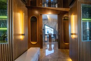 a hallway with a bench in a building at Espina Hotel in Antalya