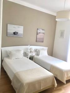 Кровать или кровати в номере Arcada House Tavira