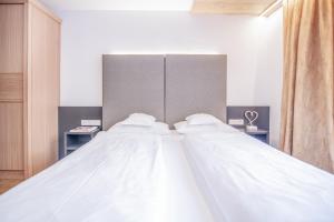 Voodi või voodid majutusasutuse Hotel Residence Rose toas