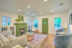 a living room filled with furniture and a fireplace at Newly Updated and Charming Azalea District Home in Tyler