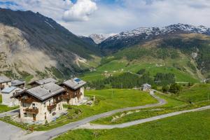 an aerial view of a mountain with a house and a road at Chalet Li Baita Daniela in Livigno