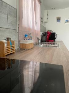 a kitchen with a sink and a counter top at Lo in Audenge