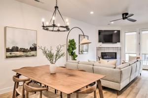 a living room with a table and a couch at Modern-Chic Provo Townhome 1 Mi to BYU Campus in Provo