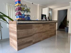 a bar in a room with a counter top at Hotel Praça da Árvore in Sao Paulo