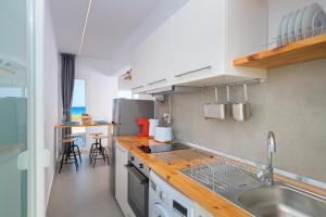 A kitchen or kitchenette at Niva Kamiros Apartments