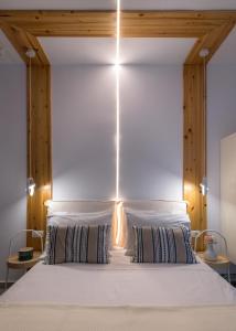 A bed or beds in a room at Niva Kamiros Apartments