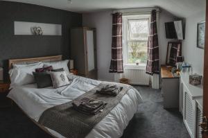 Un pat sau paturi într-o cameră la Sunbeam bed and breakfast