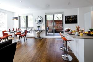 a living room with a kitchen and a dining room at Springfield Four in Harrogate