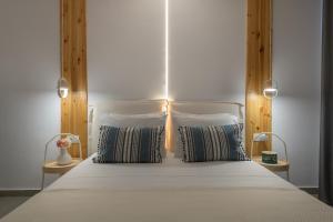A bed or beds in a room at Niva Kamiros Apartments