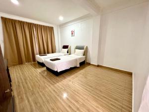 JR RESORT客房内的一张或多张床位