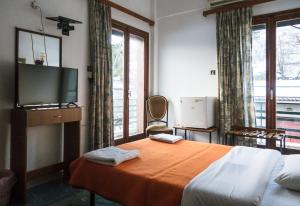 Postel nebo postele na pokoji v ubytování ARION