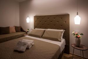 En eller flere senge i et værelse på B&B Rais Luxury Rooms