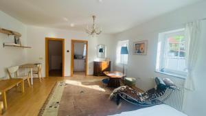 a living room with a couch and a table at Schlossapartments Wolfsberg in Wolfsberg