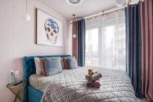 Posteľ alebo postele v izbe v ubytovaní Klimatyzacja AC w dwóch apartamentach i wentylatory w trzecim- Apartamenty MetroPark Krzemieniecka-Lux
