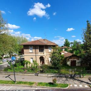 an old house sitting on the side of a street at HOTEL PERLA in Massa Lombarda