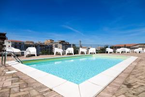 a swimming pool on the roof of a building at Rooms Dream Tropea in Tropea