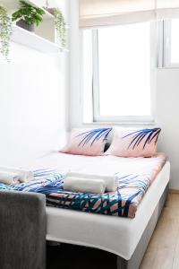 Łóżko lub łóżka w pokoju w obiekcie Lumen Studio