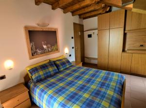 Säng eller sängar i ett rum på Alloggio Turistico Bufera