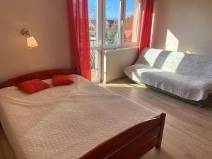 Postel nebo postele na pokoji v ubytování Pokoje Gościnne - Apartamenty MATI