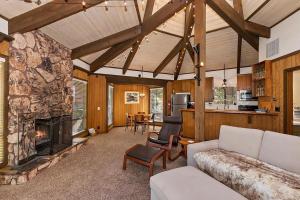 a living room with a couch and a fireplace at 021 - Tree Fort Getaway in Big Bear City