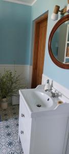 a bathroom with a white sink and a mirror at Camp Warmia in Stare Kawkowo +61 photos