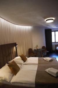 Voodi või voodid majutusasutuse Hotel Svambersky dum toas