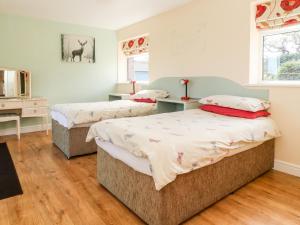 Ein Bett oder Betten in einem Zimmer der Unterkunft 2 Pines Farm Cottages