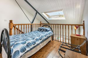 a bedroom with a bed on a wooden balcony at West Sea View No 4 in Yarmouth