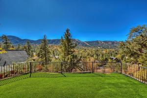a large balcony with a view of the mountains at 053 - Glass House on the Ridge in Big Bear Lake