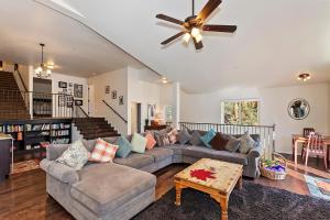 a living room with a couch and a ceiling fan at 040 - Bear Lake Retreat in Big Bear City