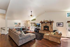 a living room with two couches and a fireplace at 040 - Bear Lake Retreat in Big Bear City
