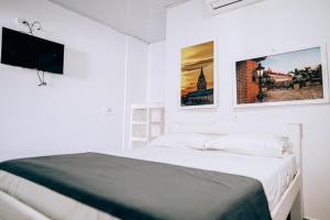 Postel nebo postele na pokoji v ubytování Neos Hotel Cartagena