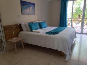 Postel nebo postele na pokoji v ubytování Paradise Island Beach Resort