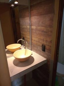 a bathroom with two sinks on a counter at Hotel boutique Pukarainca in Uspallata +59 photos