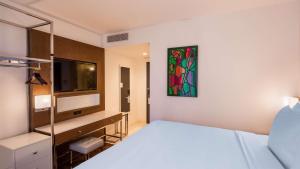 Säng eller sängar i ett rum på Best Western Premier Empire State Hotel
