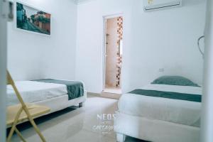 Postel nebo postele na pokoji v ubytování Neos Hotel Cartagena
