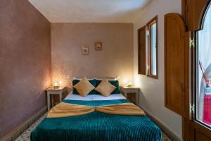 Vuode tai vuoteita majoituspaikassa Riad l'Heure d'Eté
